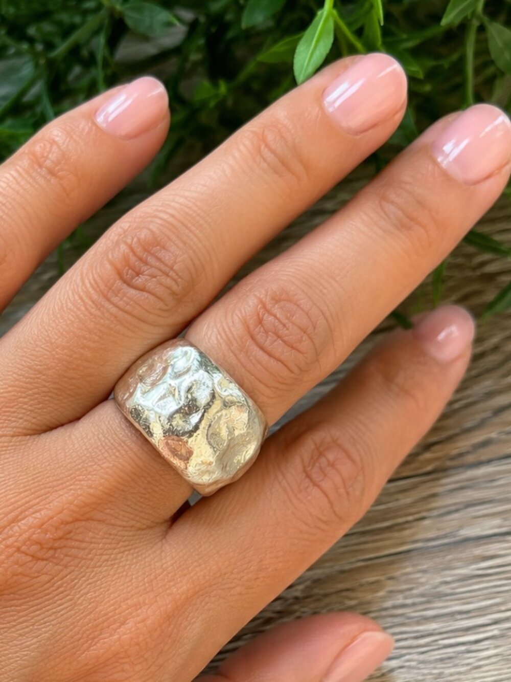 Sterling silver ring features a heavy, hammered nugget texture
